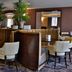 Best Western Heath Court Hotel Newmarket lounge with booths, tables and white chairs