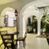 Prince of Galle in Galle courtyard dining area with arched walkways, lanterns and a tree feature
