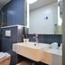 Hanting Hotel Shanghai Xujiahui Metro Station bathroom with shower, sink and toilet in Shanghai