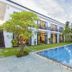 Hoi An Hideaway Villa in Hoi An with outdoor pool, palm trees and balcony rooms