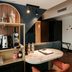 Hotel & Spa Savarin in Rijswijk suite with kitchenette, dining table and wall mirror