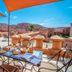 Ksar Ighnda in Aït Ben Haddou with rooftop terrace dining and panoramic desert mountain views