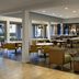 Courtyard by Marriott San Mateo Foster City lobby restaurant with tables, chairs, and bar seating