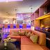 Leonardo Hotel Wolfsburg City Center lounge with bar seating and fireplace in Wolfsburg