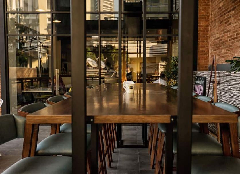 Liberty Hotel Thamrin Jakarta dining area with long wooden table and chairs in Jakarta