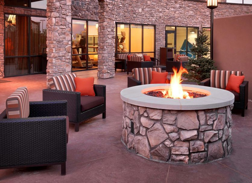 Courtyard by Marriott Lehi at Thanksgiving Point patio with stone fire pit and seating
