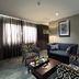Fiesta Residences Boutique Hotel and Serviced Apartments, Accra: stylish suite living area with sofa and chairs