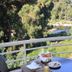 Hotel Costa Rossa in Porto balcony table with breakfast and forest valley view