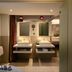 Kruisherenhotel Maastricht bathroom with dual sinks, mirrors, and tub in Maastricht