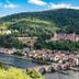 Staycity Aparthotels Heidelberg with panoramic view of Heidelberg, river and stone bridge below forested hills