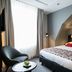 Bilderberg Grand Hotel Wientjes Zwolle guest room with double bed and city-view artwork