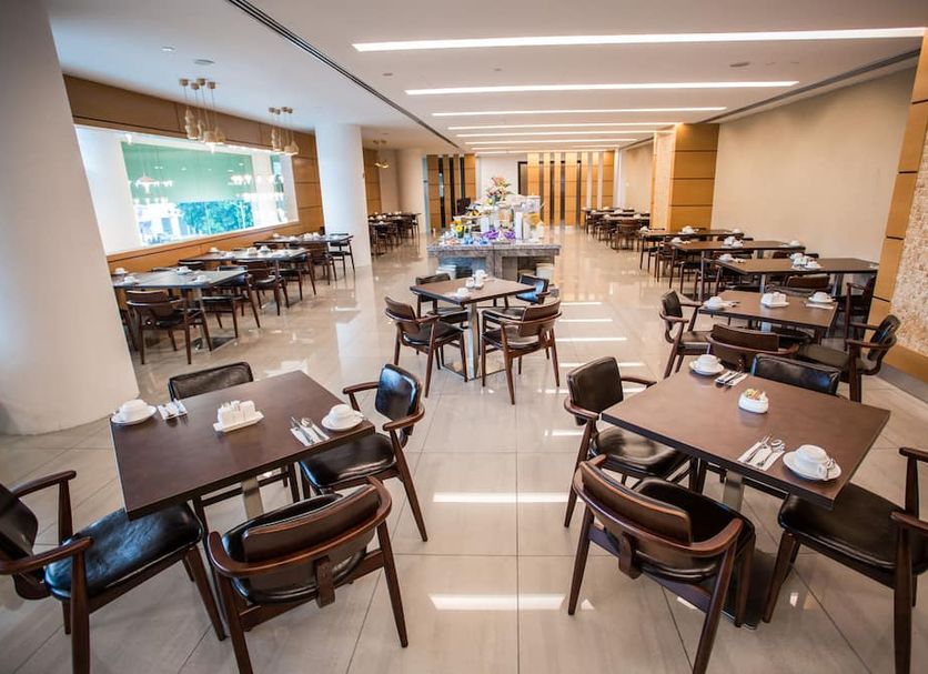 V8 Hotel in Johor Bahru restaurant with neatly set dining tables and bright modern interior