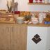 Breakfast buffet at Pension Berggeist in Sölden with pastries, fruit juice, and cereal dispensers