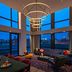 Moxy NYC Lower East Side lounge with floor-to-ceiling city views in New York and circular ceiling lights