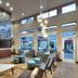 Residence Inn by Marriott Lubbock-University Area lobby with tall stone fireplace, seating area, and large windows