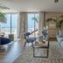 Bahia Del Duque in Adeje living room with sofa, coffee table and balcony ocean view
