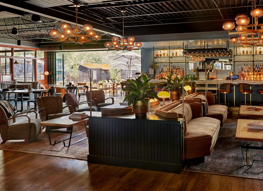 High Country Motor Lodge in Flagstaff lounge with bar, leather seating, and warm pendant lighting