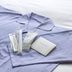 Toyoko Inn Gumma Isesaki Ekimae: folded lavender pajamas with toiletries on a bed
