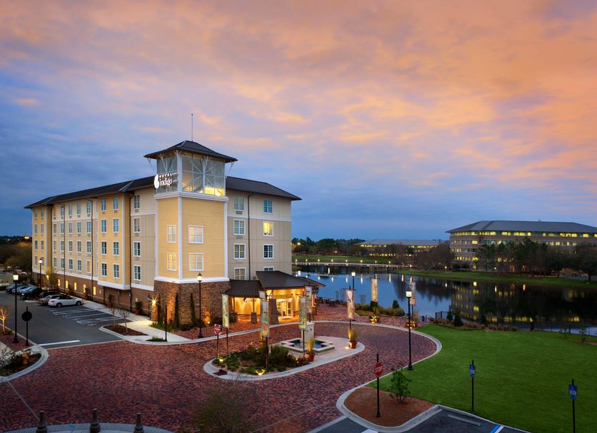Hotel Indigo Jacksonville-Deerwood Park By IHG in Jacksonville with lakefront patio at sunset
