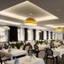 Ferien Appartements Am Berghotel Oberhof dining room in Oberhof with set tables and chandeliers