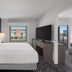 Hyatt House Emeryville/San Francisco Bay Area room with king bed, TV, and city view