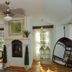 The Connecticut River Valley Inn in Glastonbury: cozy sitting room with fireplace, windows, and hanging egg chair