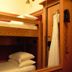 West Village Eurohostel in New York: bunk beds and compact wood-paneled hotel room