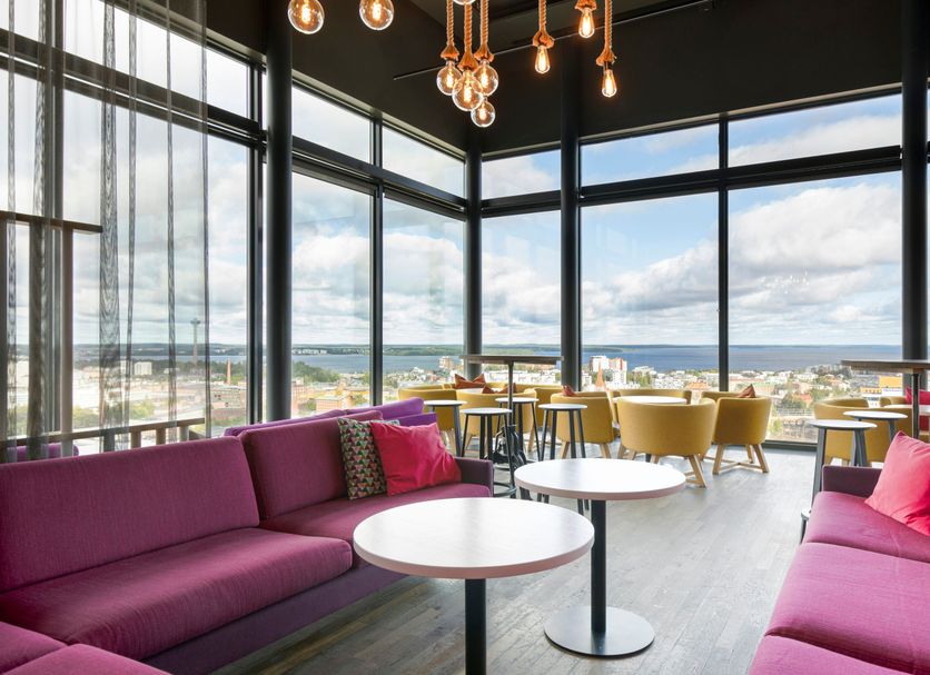 Solo Sokos Hotel Torni Tampere rooftop lounge with floor-to-ceiling windows and city views in Tampere