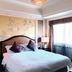 Ramada Plaza by Wyndham Tian Lu Hotel Wuhan guest room with king bed and large window in Wuhan