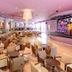 Protur Badia Park Aparthotel in Sa Coma, bar lounge with seating and stage