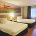 Days Inn by Wyndham Osage Beach Lake of the Ozarks room with two beds and lake sunrise wall art