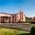 Red Roof Inn Virginia Beach - Norfolk Airport exterior with red sign and entrance in Virginia Beach