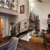 Orlowska Townhouse Apartments Krakow: elegant duplex suite with spiral staircase, dining area, and kitchenette