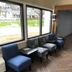 Super 8 by Wyndham Asheville/Biltmore lobby seating area with chairs by large windows