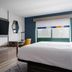 Holiday Inn Express & Suites Drums-Hazleton room with king bed, desk, TV and wardrobe