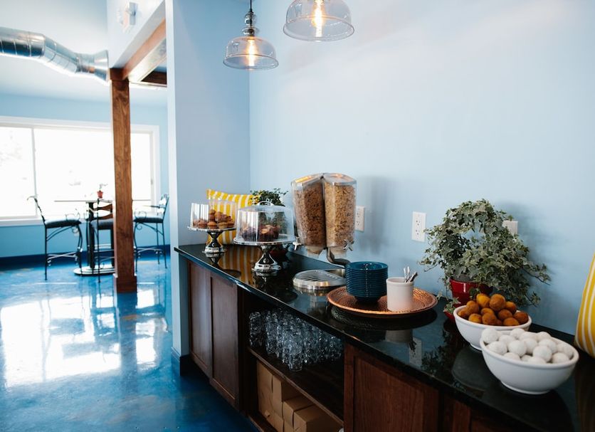 Breakers Resort - Lakeside in Saint Ignace: bright breakfast buffet with cereal, fruit, and a blue floor