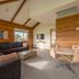 The Retreat at West Beach Parks living room with sofa, dining table and TV in West Beach