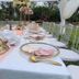 Hotel Troy Nairobi outdoor banquet table with floral centerpieces and white chairs
