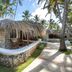 Viva Wy Dominicus Beach in La Romana: thatched stone bungalow along a palm-lined path