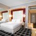 The Lin Hotel, Taichung City: modern guest room with king bed, mirrored wall, and hallway view