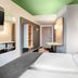 B&B Hotel Baden-Airpark room in Rheinmunster with twin beds and a green ceiling