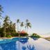 Nataya Round House Coral Bay Resort in Kampot with palm-lined infinity pool overlooking the sea
