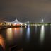 Hotel Glodok Plaza in Jakarta with nighttime waterfront city views and illuminated tower reflections