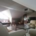 Hotel Vivar in Griñón: attic lounge with sofas, coffee table and sloped ceiling