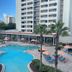 Holiday Inn Orlando-Disney Springs Area By IHG in Lake Buena Vista with large outdoor pool and palm trees