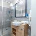 Appart'City Classic Reims Parc des Expositions bathroom with walk-in shower and vanity in Reims