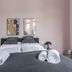 limehome Baden-Baden Bäderstraße room with twin beds, rolled towels, and bedside lamps in Baden-Baden