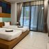 Chalay Monta Hua Hin room with two beds and balcony doors