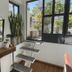 Le Petit Palais, Buenos Aires: modern guest room with stairs, window, mirror, and potted plants