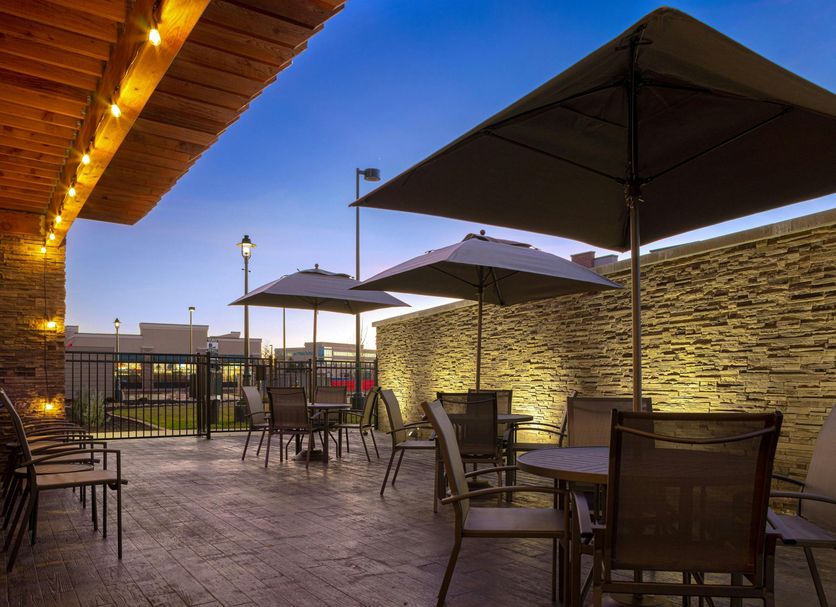 Fairfield by Marriott Inn & Suites Denver Airport at Gateway Park outdoor patio with tables, umbrellas and lights in Denver